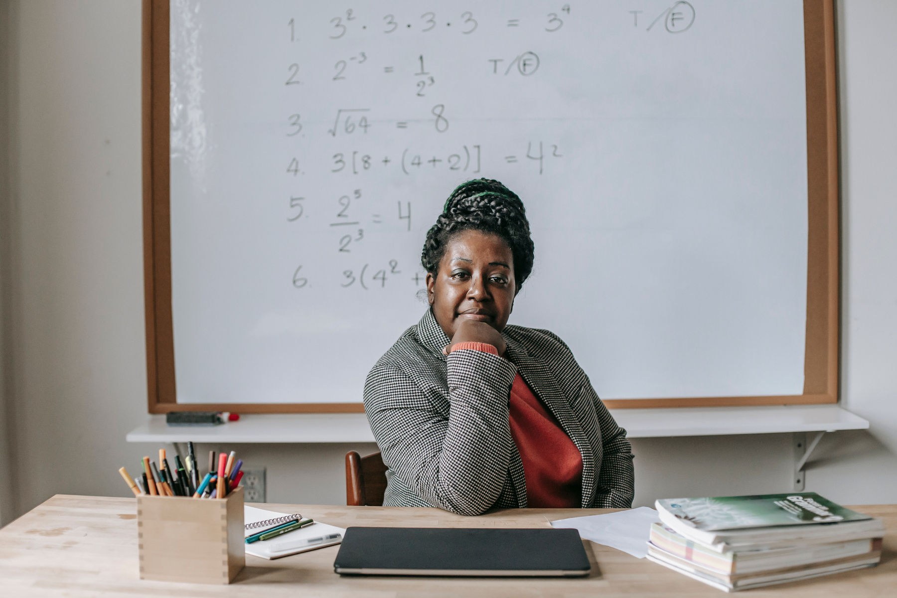 Confident black woman sitting in classroom